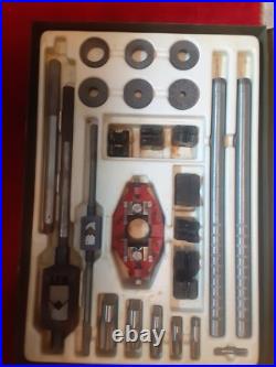 Pipe tap and die set in a metal case