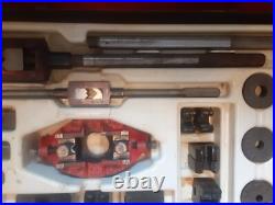 Pipe tap and die set in a metal case